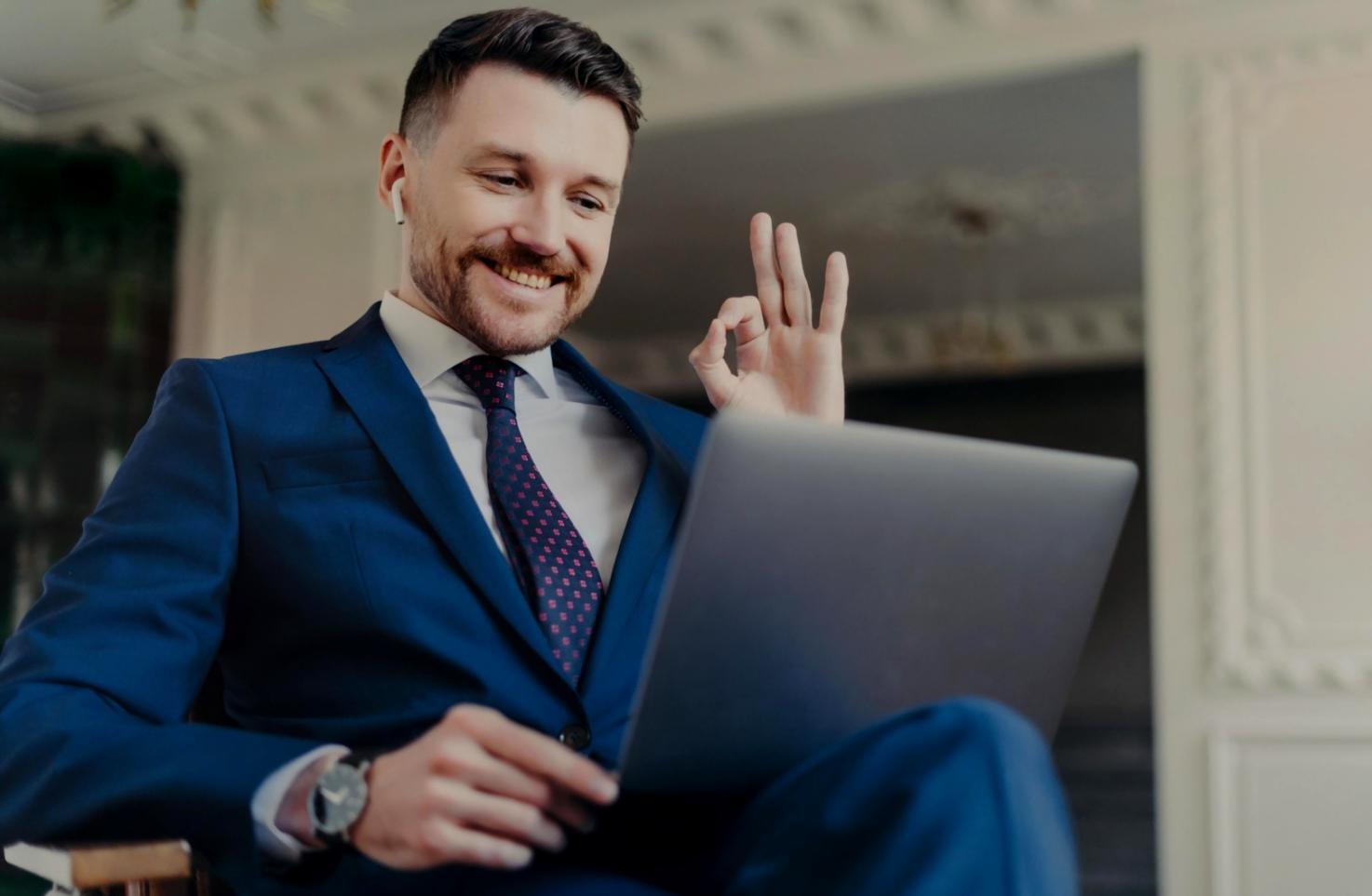 Business professional reviewing automated financial reports on multiple screens